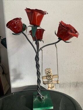 Red Metal Rose Sculpture with Hanging Figure